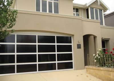 Inspirations garage door – aluminium frame with Dark Bronze polycarbonate multiwall inserts
